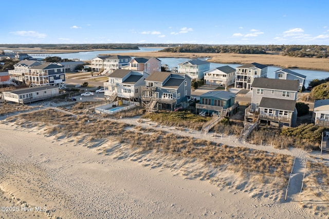 4827 W Beach Dr, Oak Island, NC 28465 - birds eye view of property featuring a residential view and a water view