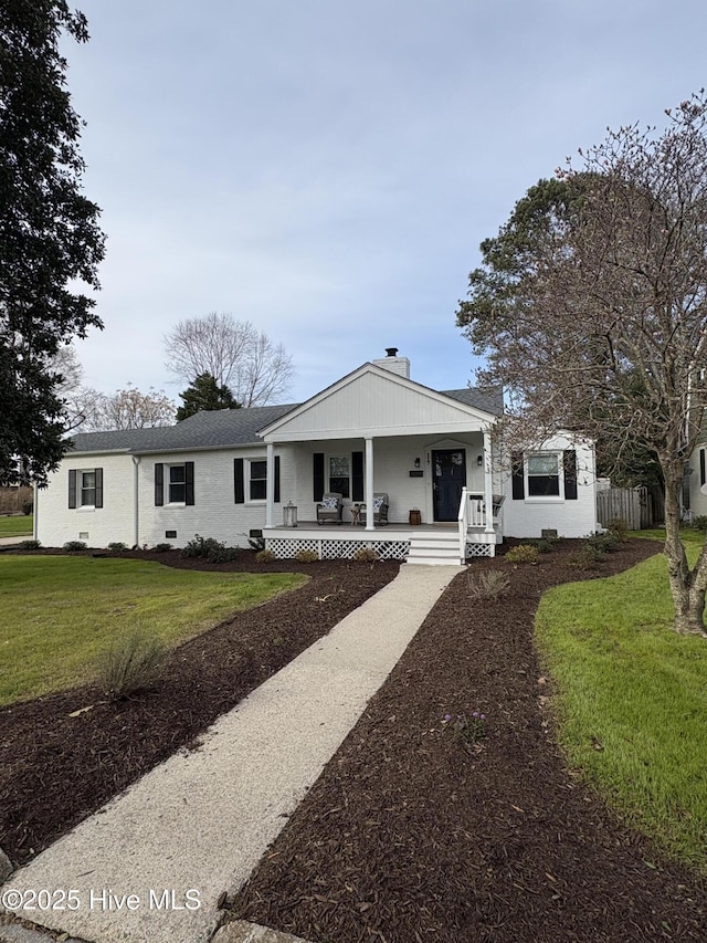 view of front of house featuring crawl space, covered porch, and a front lawn