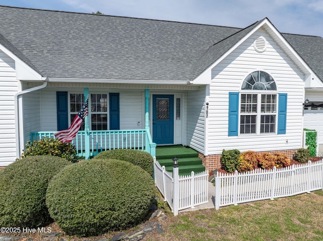 view of front of house with a fenced front yard, a porch, a shingled roof, and a garage