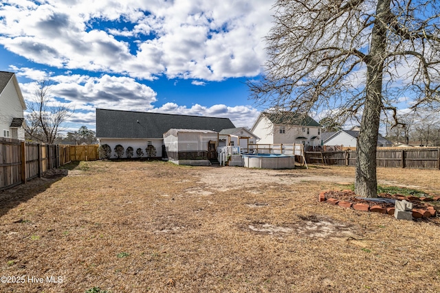 view of yard with a fenced backyard and a fenced in pool