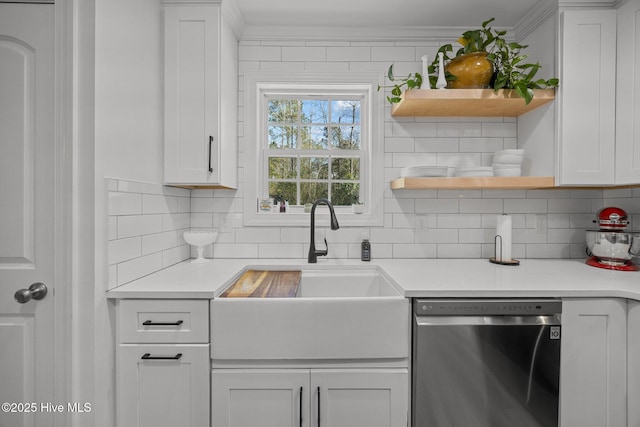 kitchen featuring tasteful backsplash, white cabinets, dishwasher, open shelves, and a sink