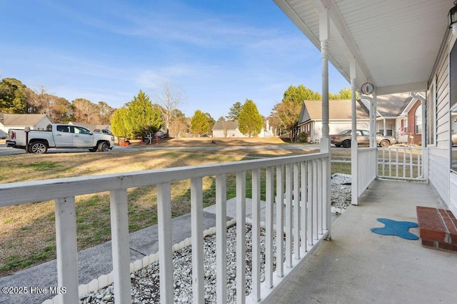 balcony featuring a porch and a residential view