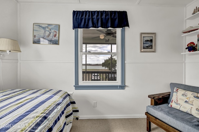 bedroom with carpet floors and baseboards