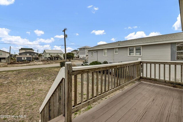 wooden deck with a residential view