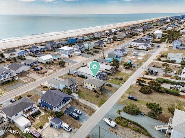 aerial view featuring a water view and a view of the beach