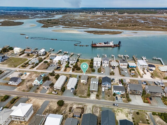 drone / aerial view featuring a water view and a residential view