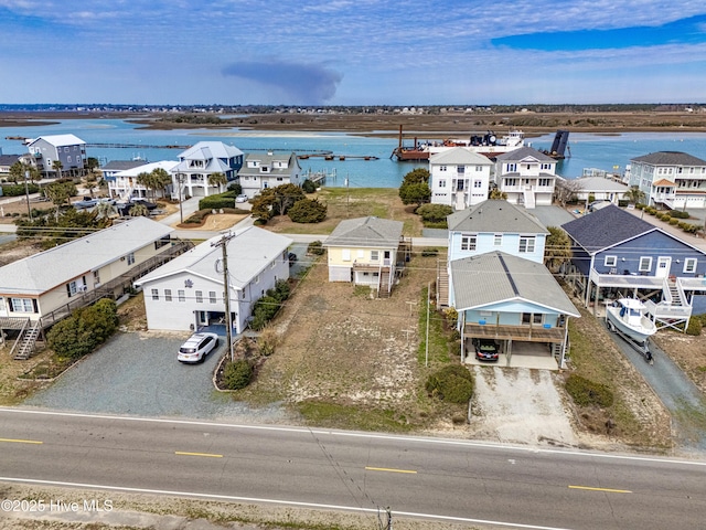 bird's eye view featuring a residential view and a water view