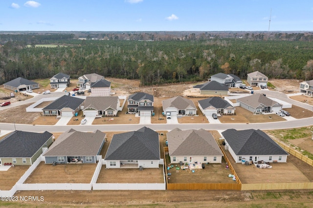 birds eye view of property with a residential view and a view of trees