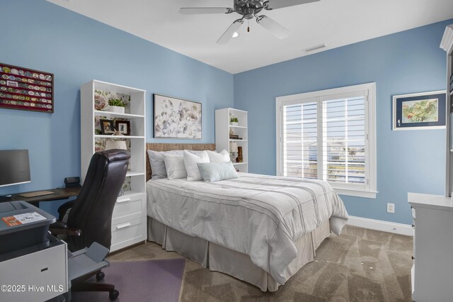 bedroom with visible vents, baseboards, carpet, and a ceiling fan