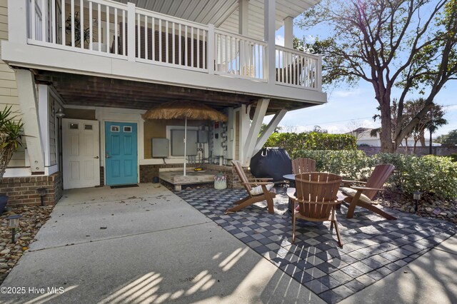 view of patio / terrace with a garage and concrete driveway