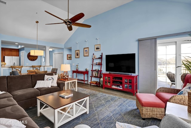 living room with high vaulted ceiling, wood finished floors, visible vents, and ceiling fan