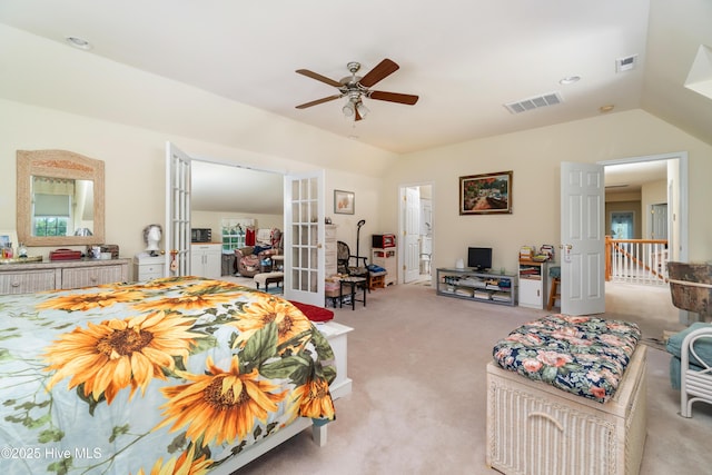 bedroom featuring visible vents, lofted ceiling, light colored carpet, and french doors