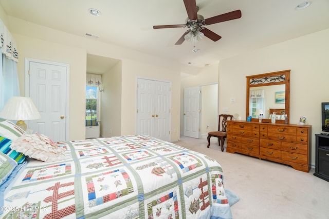 bedroom featuring a ceiling fan, recessed lighting, light colored carpet, and visible vents