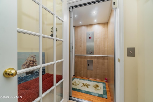 doorway featuring elevator and recessed lighting