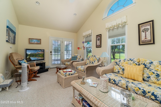 living area featuring high vaulted ceiling, a wealth of natural light, and carpet floors