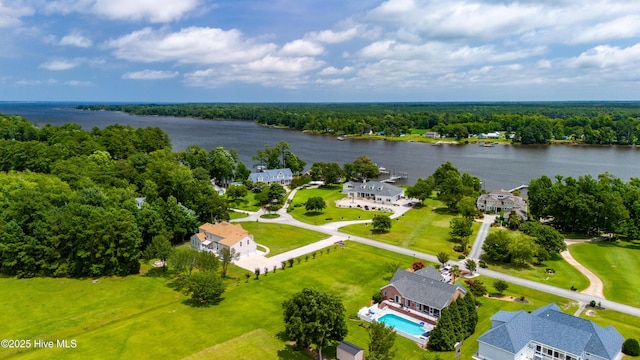 drone / aerial view with a view of trees and a water view