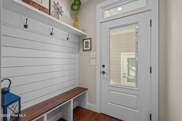 mudroom with dark wood-style flooring