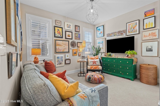 sitting room with carpet floors and baseboards