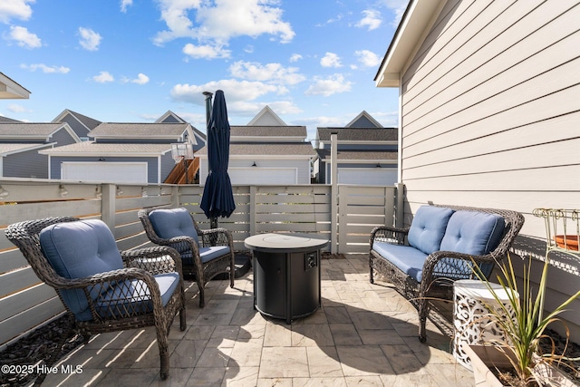 view of patio / terrace with outdoor lounge area and fence