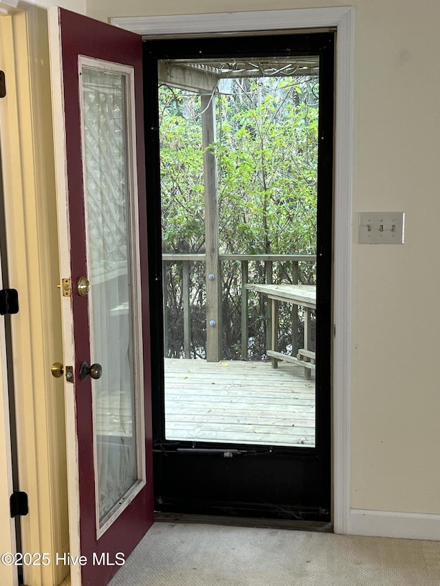 entryway with carpet flooring