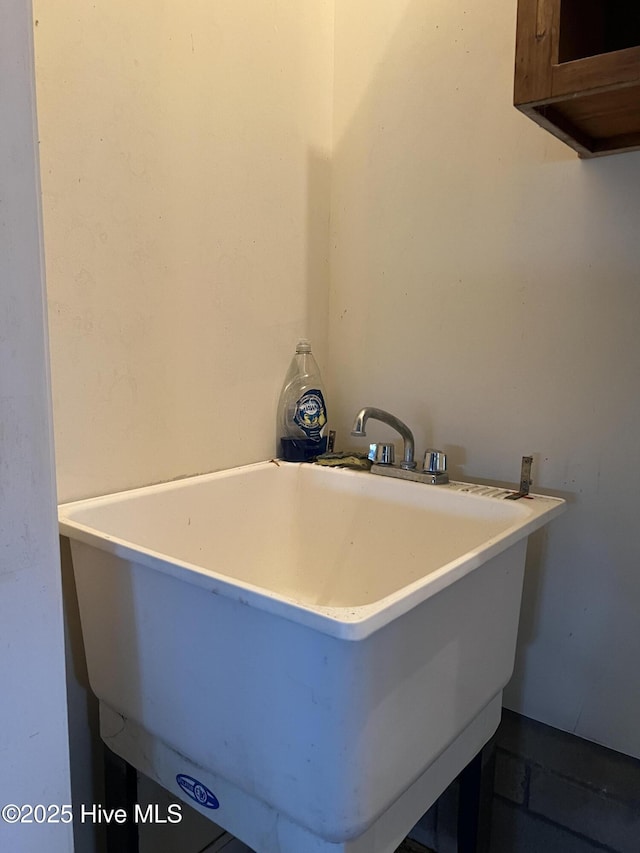 interior space featuring a sink and a soaking tub