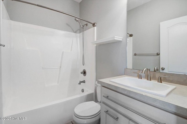 bathroom with toilet, bathtub / shower combination, and vanity