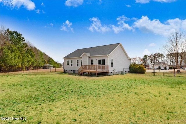 back of house with a yard, crawl space, a wooden deck, and fence