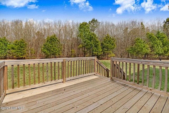 wooden deck with a forest view