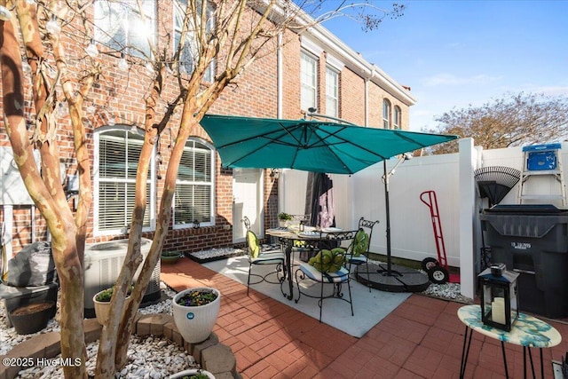 view of patio / terrace with outdoor dining area and fence