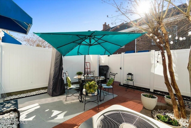 view of patio / terrace with outdoor dining area and a fenced backyard