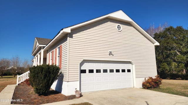 view of side of home featuring a garage