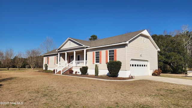 ranch-style home featuring driveway, covered porch, an attached garage, and a front lawn