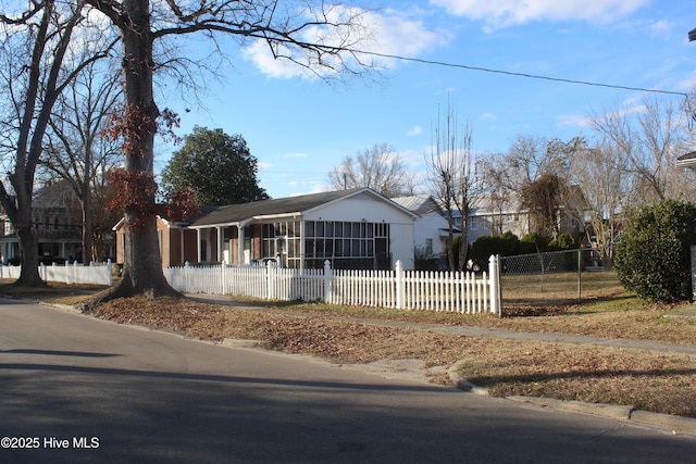 ranch-style house with a fenced front yard