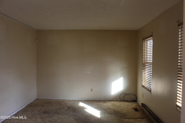 carpeted empty room with visible vents