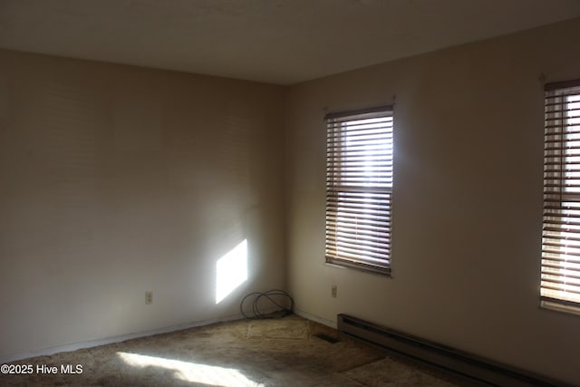 spare room featuring baseboard heating