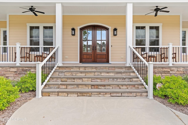 property entrance with a porch, french doors, and a ceiling fan