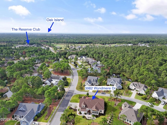 3982 Wyndmere Dr, Southport, NC 28461 - aerial overview of property's location featuring a heavily wooded area and nearby suburban area