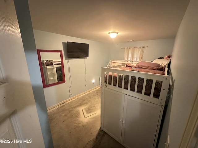 bedroom featuring unfinished concrete floors