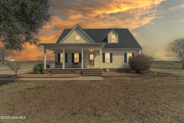 view of front of property featuring crawl space, covered porch, and a front lawn