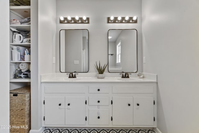 bathroom featuring double vanity and a sink