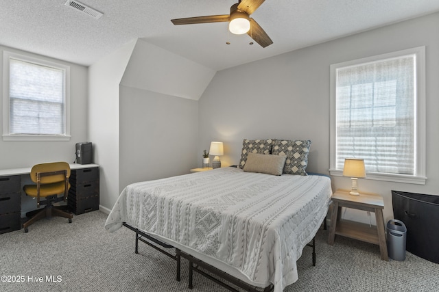 bedroom featuring ceiling fan, multiple windows, carpet, and visible vents