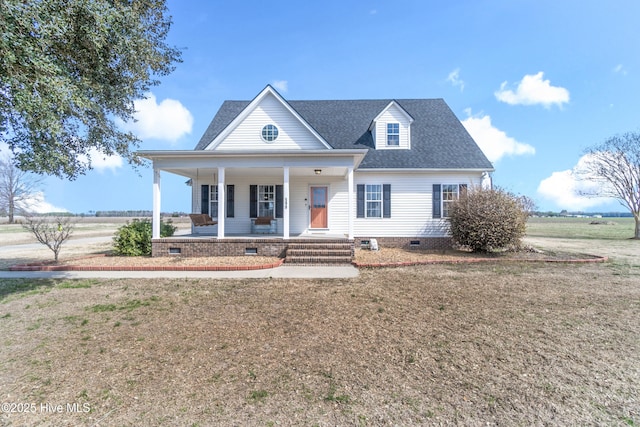 view of front of home with covered porch, roof with shingles, crawl space, and a front yard