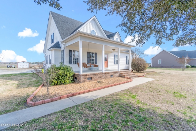 view of front of house featuring covered porch, a front lawn, crawl space, and a shingled roof