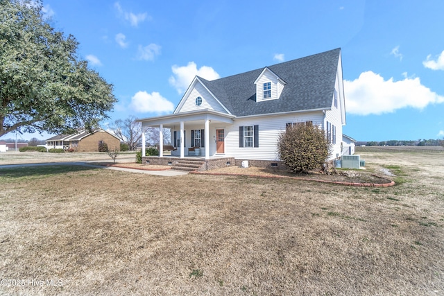 view of front of house with a porch, a front yard, crawl space, and roof with shingles