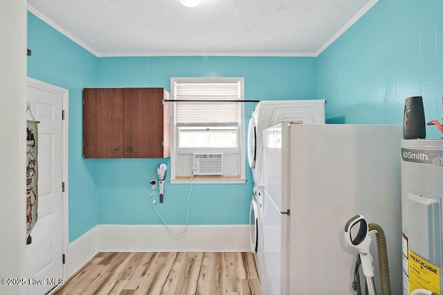 washroom featuring crown molding, stacked washer and dryer, water heater, cooling unit, and wood finished floors