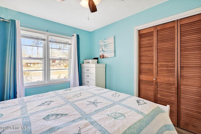 bedroom with a closet and a ceiling fan