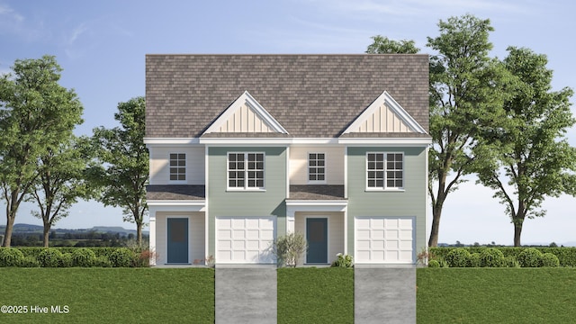 view of front of home featuring a shingled roof, concrete driveway, board and batten siding, a front yard, and a garage