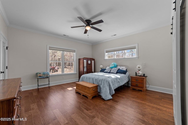 bedroom featuring baseboards, visible vents, wood finished floors, and ornamental molding