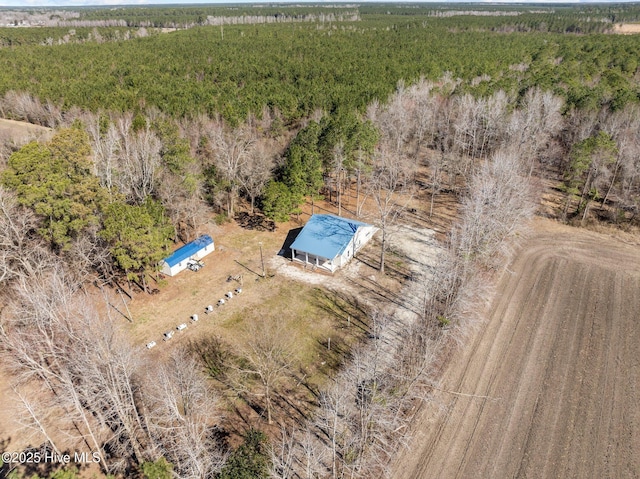 aerial view featuring a view of trees