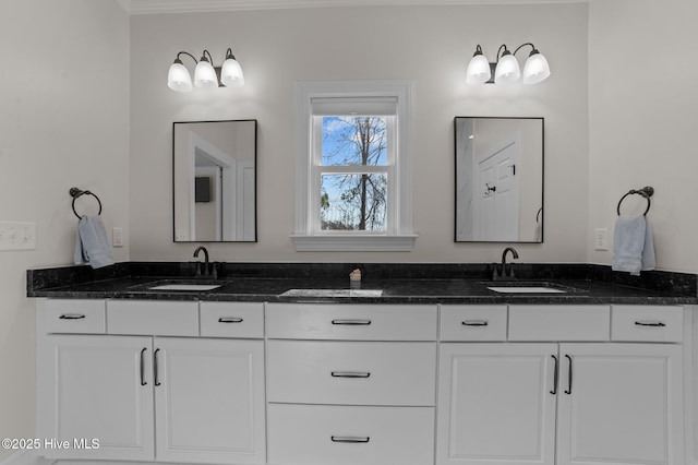 bathroom featuring double vanity and a sink